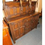 An Ercol style court cupboard.