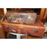 Two leather suitcases, with brass locks.