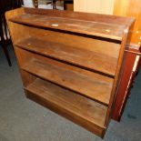 A mid century mahogany low floor standing bookcase.