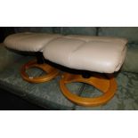 Two Stressless style footstools, with fawn upholstery, supplied by Morris Furniture Group.