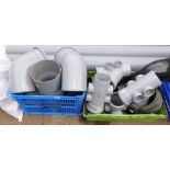 Two boxes of industrial drain pipe fittings, including corners, spurs, joints, etc.