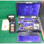 A black leather jewellery box and contents, with a crushed purple velvet interior, with Dunhill ligh