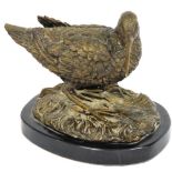 A bronze figure of a Sandpiper, cast on a naturalistic ground, and oval black marble base, unsigned,