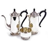 A George V silver coffee pot, matching hot water jug and sugar basin, Robert Pringle and Sons, Londo