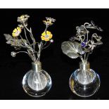 A pair of late 20thC miniature silver mounted clear glass vases, of bulbous form, one containing sil