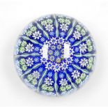 A Paul Ysart glass millefiori paperweight, of concentric form, interspersed with spiral twist canes