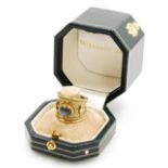 An Elizabeth Gage 18ct yellow and white gold 'Templar' ring, set with a central cabochon cut treated