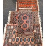 A Pakistan hand knotted rug, in geometric pattern on a peach ground, 83cm wide, various other rugs,