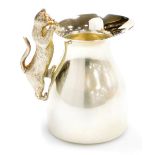 An Elizabeth II silver cream jug, the handle cast with a figure of a cat, Peter Nicholas and Co, Lon