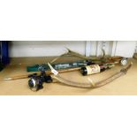 A Quantum SS20 Max Cast fishing reel, walking stick mounted with a bottle of German beer, antlers, e