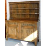 An oak Old Charm style dresser, 166cm high, 143cm wide, 48cm deep. Lots 1501 to 1561 are available