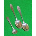 A pair of silver teaspoons and a mustard spoon.