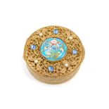 An Eastern inspired enamel pill box, the gilt floral design tops set with seed pearl and paste stone