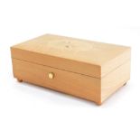 A late 20thC Swiss music box, with Eine Kleine Nachtmusik Allegro Mozart box, in a lightwood case in