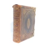 A 19thC leather bound and gilt metal mounted Holy Bible. (AF)