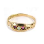 A 9ct gold gypsy ring, set with garnet, opal and seed pearls, with applied and raised V splayed shou