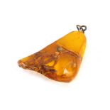 An amber pendant, with in growing bark with a single pendant loop mount white metal unmarked, 4cm hi