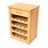 An oak wine rack, with rectangular top, above single drawer, 74cm high, 53cm wide, 41cm deep.