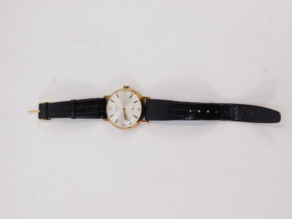 A Longines 9ct gold gent's wristwatch, with a silver coloured dial, with four point number section a - Image 3 of 3