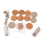 Two silver ingot pendants, a silver chain, and a small group of coins, including old pennies, the in