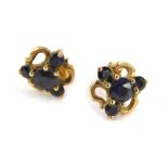 A pair of 9ct gold stud earrings, each formed as a cluster set with sapphires, 1.5g all in.
