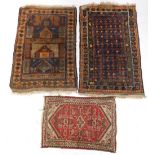 A group of Persian rugs, to include a prayer rug with a geometric design in electric blue within mul