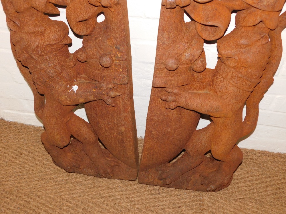 A pair of cast iron lion shield crests, each half the picture, with lion holding crest, bearing rubb - Image 4 of 4