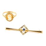 A 9ct gold cameo dress ring, ring size K½, and a bar brooch with central square design set with blue