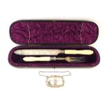 A Victorian silver and ivory serving knife and fork, engraved floral and foliate decoration, cased,