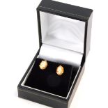 A pair of 9ct gold cameo stud earrings, each with oval cameo in basket setting on 9ct gold frame wit