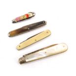 Four penknives, comprising a silver and mother of pearl handled penknife, a bone and stainless steel