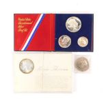 A George VI crown 1951, United States bicentennial silver proof set 1976 and a Maria Theresa thaler.