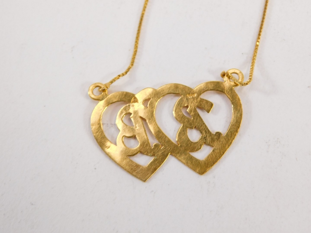 An enamel and yellow metal pendant and chain, the two adjoining heart pendant bearing the initials B - Image 3 of 3