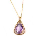 A 9ct gold pendant and chain, the oval pendant set with central oval amethyst in four claw setting,