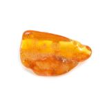 A piece of natural amber, with various growth specks and rubbed detailing, 5cm wide, 12.4g all in.