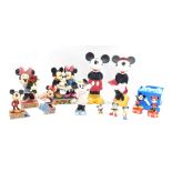 A group of Disney figures, comprising Disney traditions Le Vie En Rose, Disney traditions Mickey and