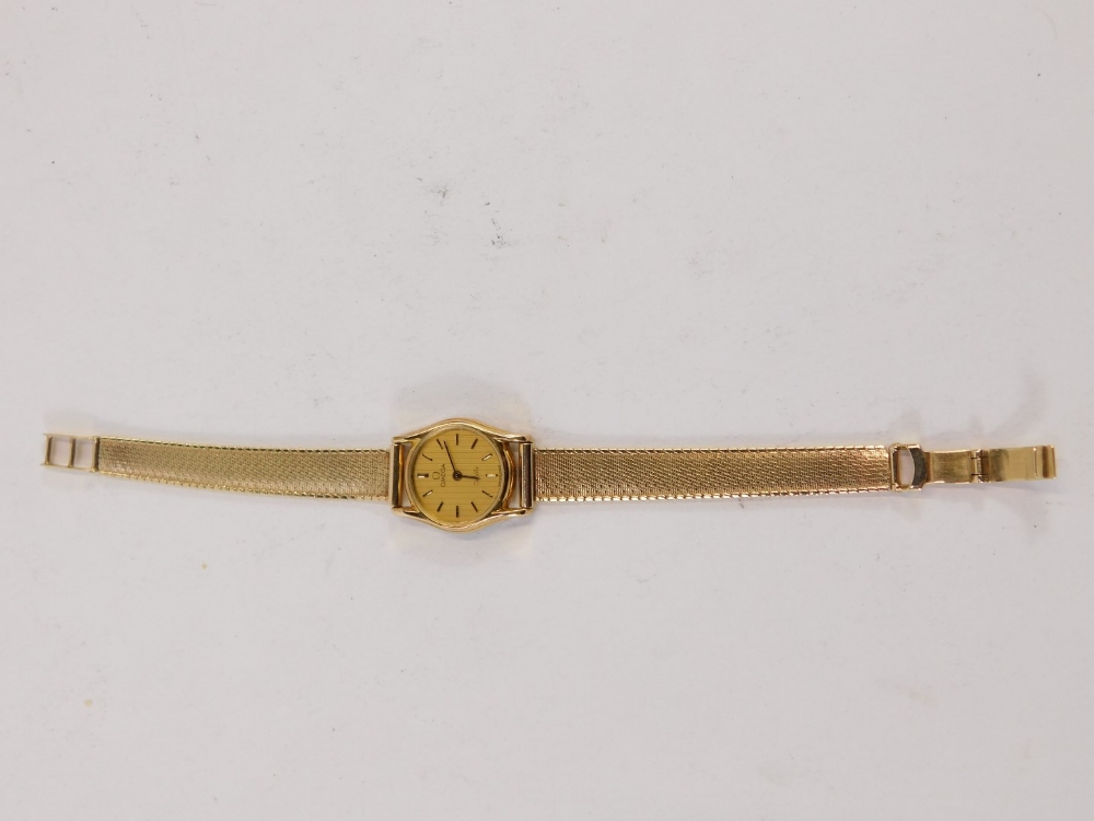 A 9ct gold Omega De Ville lady's wristwatch, with circular watch head, with 1.5cm dial, on bar set b - Image 5 of 5