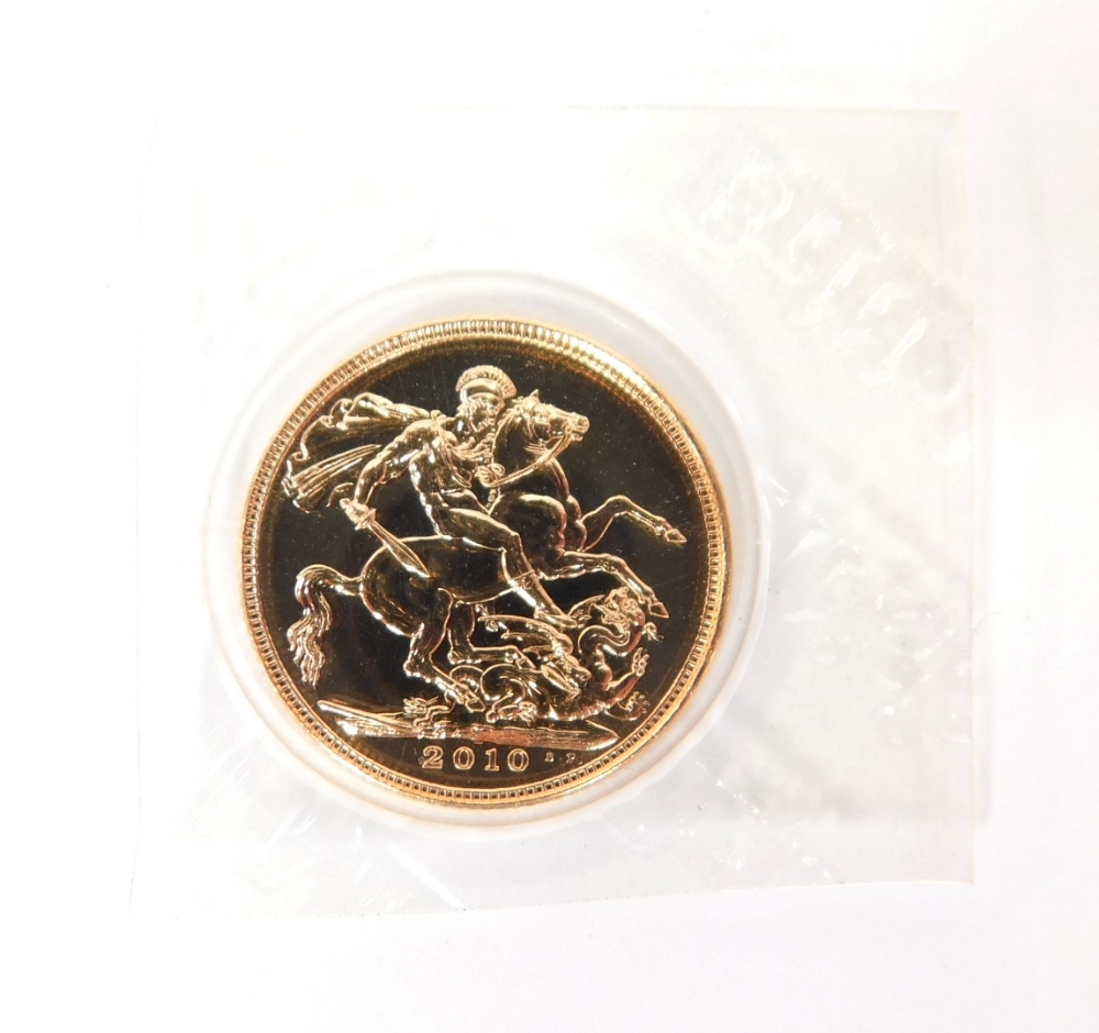 An Elizabeth II full gold sovereign, dated 2010.