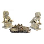 A pair of carved soapstone dogs of fo, each on plinth, 15cm high, together with a carved soapstone t
