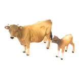 Two matt finish Beswick ornaments, comprising a Jersey cow and calf. (2)