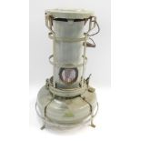 An Aladdin paraffin heater, in green, each with carrying handle, 56cm high.