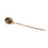 A 9ct rose gold memorial stick pin, the oval top with interwoven plaque of hair, on a twist design p