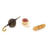 Three Victorian and later trinkets, comprising a carved wooden needle case, a present from the Thame