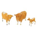 Three Beswick matt finish ornaments, comprising a Guernsey bull, cow and calf, the bull marked Ch Sa