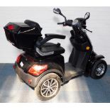 A Veleco Luxury electric scooter mobility scooter, with charger pack.