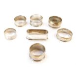 Seven Victorian and later silver napkin rings, one named to 'Jean', three initialled or monogrammed,