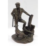 A Heredites bronzed figure of a gamekeeper and hound, inscribed David Hermes, 25cm high.