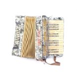 An Alvari piano accordion, cased with instruction book.