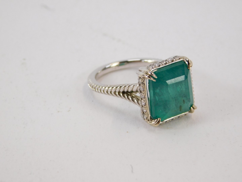 An emerald and diamond dress ring, with octagonal step cut emerald, measuring 12.10 x 11.11 x 8.77mm - Image 2 of 5