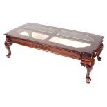 An Eastern hardwood coffee table, with cabriole shell capped legs, with four glass insets to top, 40